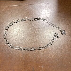 Heart shaped metal bracelet. No markings